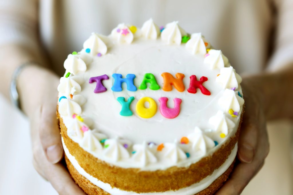 Elegant thank you cakes with personalised message and decorative frosting