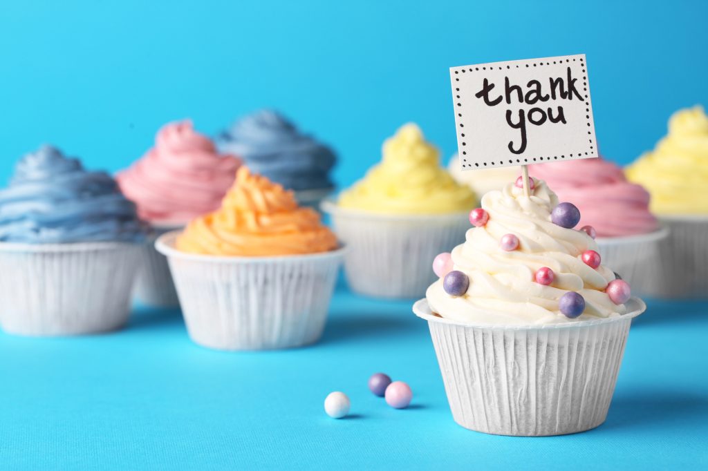 Assorted thank you cakes cupcakes arranged for a casual appreciation gift